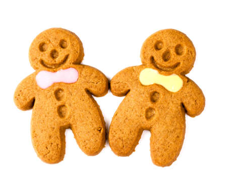 two gingerbread figures on a white backgroundの写真素材