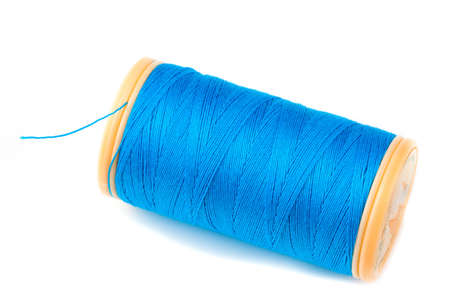 Blue Threas on reel on white background