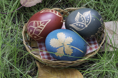 Basket with eggs on grass