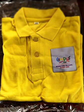 Chennai,TamilNadu/India-0702018 A brand new yellow colored school uniformの写真素材