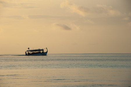 Traditional boat and ocean sunset, Ari-Atoll. Maldives