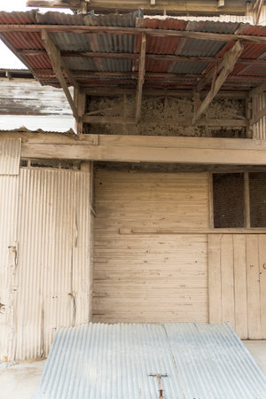 An exterior view of an abandoned factory with corrugated siding.の写真素材