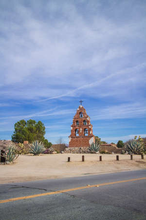 A wide view of the bell tower viewed from across the street in the afternoon.の写真素材