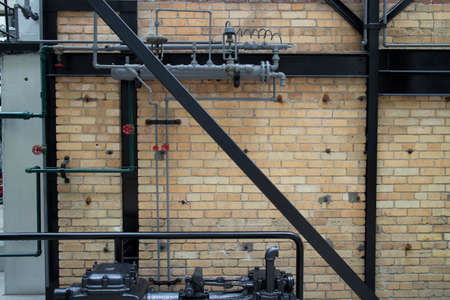 An interior view of a restored factory with brick walls and steel framing.の写真素材