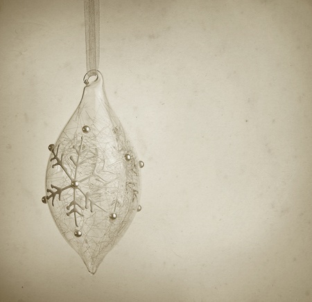 old fashioned christmas postcard with glass bubble, old paper texture addedの写真素材