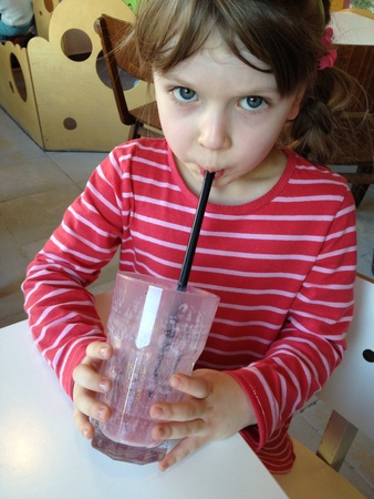 Child drinking fruit mill-shakeの素材