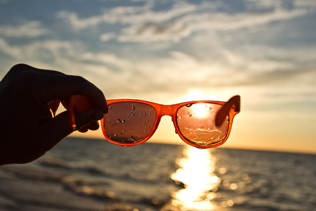 sunset through sunglassesの写真素材