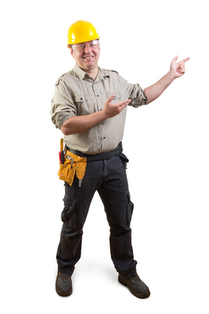 smiling worker with presenting gesture, clipping path includedの写真素材