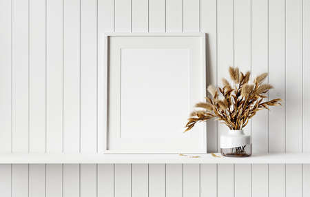 Mockup picture frame on white shelf. White planks wall background. 3D render. 3D illustration.の写真素材
