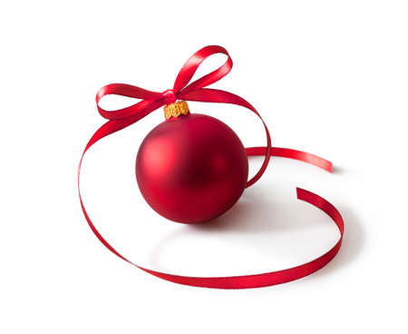 Red bauble, christmas ball with a ribbon decoration, isolated on white background.の写真素材