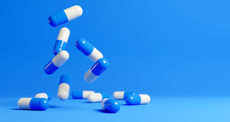 Blue and white medical capsules falling down on the blue background. 3D render. 3D illustration.の写真素材