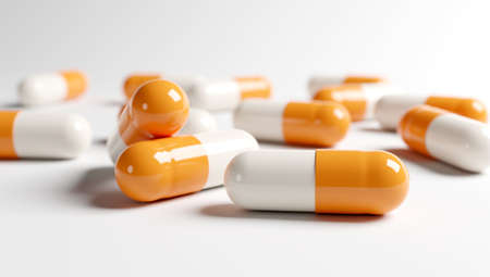 Yellow and white medical capsules on the white background. 3D render. 3D illustration.の写真素材
