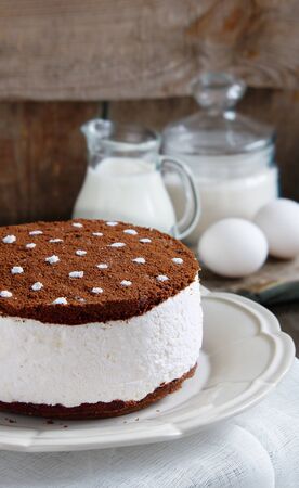 cake souffle with cream and chocolate cookie crumbsの写真素材