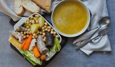 Cocido, traditional chickpea-based stew from Madrid.  on the grey stone backgroundの写真素材