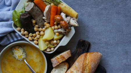 Cocido, traditional chickpea-based stew from Madrid. on the grey stone backgroundの写真素材