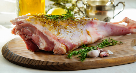 lamb leg raw with olive oil and mustard seeds marinadeの写真素材