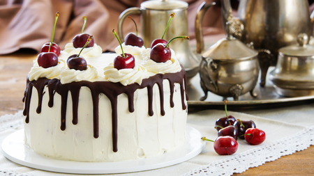 Black forest cake, Schwarzwalder Kirschtorte, Schwarzwald pie, dark chocolate and cherry dessert on wooden backgroundの写真素材