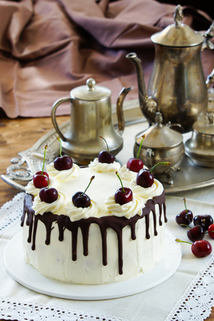 Black forest cake, Schwarzwalder Kirschtorte, Schwarzwald pie, dark chocolate and cherry dessert on wooden backgroundの写真素材