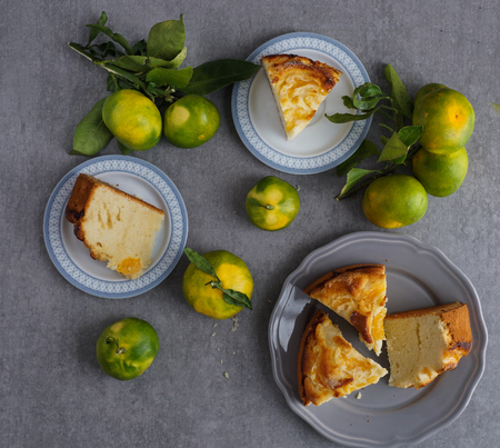 tangerine cake on the grey stone background, top view, flat layの写真素材