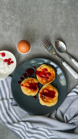 cottage cheese pancakes, tasty healthy breakfast, top view, grey stone backgroundの写真素材