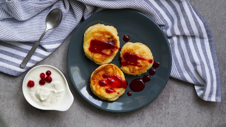 cottage cheese pancakes, tasty healthy breakfast, top view, grey stone backgroundの写真素材
