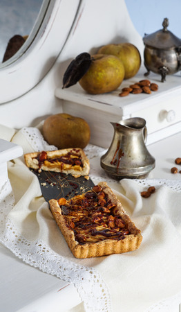 caramel apple tart on the white wooden buffet, grey rennet applesの写真素材