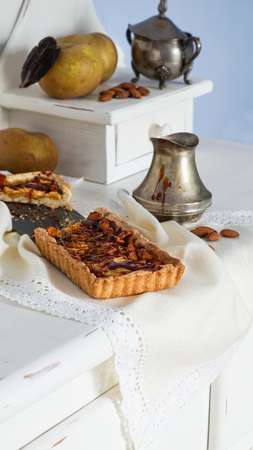 caramel apple tart on the white wooden buffet, grey rennet applesの写真素材