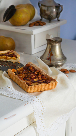caramel apple tart on the white wooden buffet, grey rennet applesの写真素材