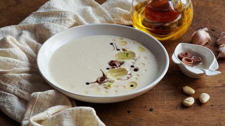 ajo blanco, spanish typical cold soup, made of almonds and garlic with olive oil and bread. white garlic soupの写真素材