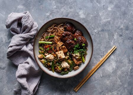 asian vegan soba noodle  with tofu cheese,shiitake mushroms, top view, copy spaceの写真素材