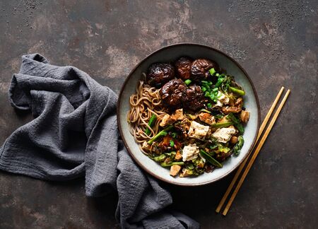 asian vegan soba noodle  with tofu cheese,shiitake mushroms, top view, copy spaceの写真素材