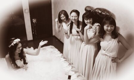 CHINA NANCHANG February 26, 2015: bride introducing her bridesmaids in the roomのeditorial素材
