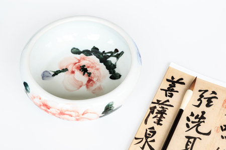 Calligraphy brush and ceramic bowlのeditorial素材