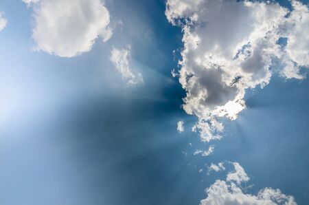 clouds and sun in blue sky in the nature