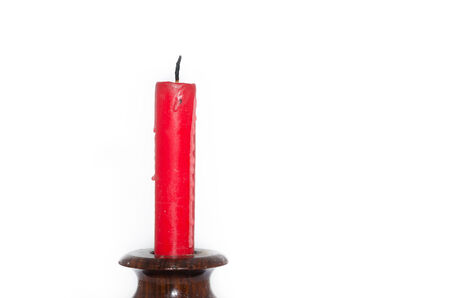 red candle wood candlestick on the white backgroundの写真素材