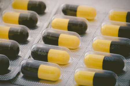 Black and yellow capsule pack madicine heath conceptの写真素材