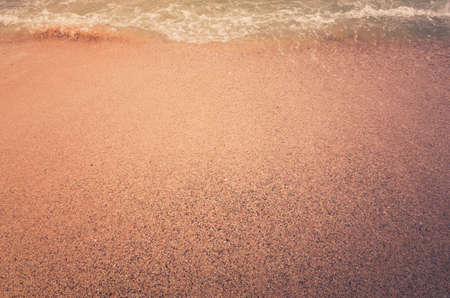 Wave of the sea on  sand beach in Thailand vintageの写真素材
