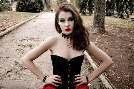 Close-up portrait of a beautiful woman witch costume Halloween look directly into the cameraの写真素材
