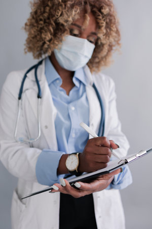 Doctor writes information to the history of the disease