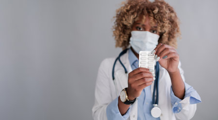 Doctor or pharmacist with a productの写真素材