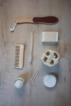 Top view eco-friendly reusable bath accessories: sponges, soap on a wooden backgroundの写真素材
