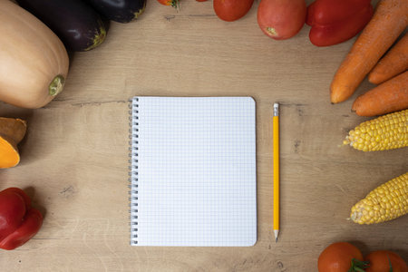 Colorful vegetables vegan food with blank notepad place for text mocap copy spaceの写真素材