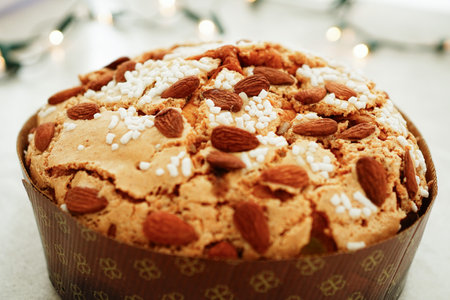 Closeup of Panettone glassato alle mandorle (Italian traditional almond panettone ) on a light background.の写真素材