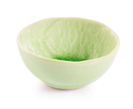 Green handmade pottery cup on white background. clipping pathの写真素材