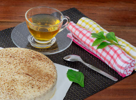 Tea and cakes on the wooden tableの写真素材