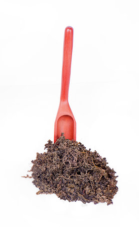 Dry tea leaves isolated on white background.の写真素材