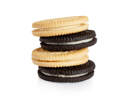 sandwich cookies isolated with cream on white backgroundの写真素材
