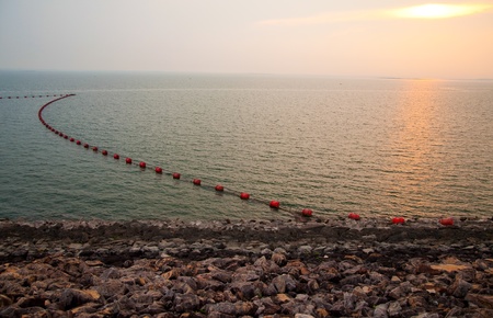 sunset at sirikit dam, thailandの写真素材