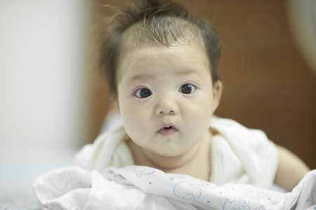 Babies learn to overturn and flip over.の写真素材