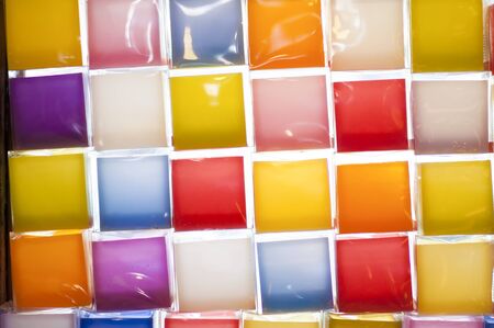 Candle sticks arranged in various shapes and colors.の写真素材